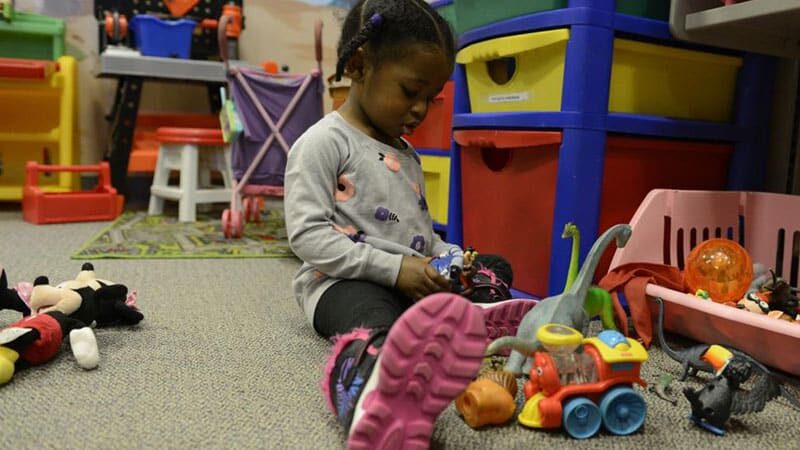 little girl playing at Children's waiting room